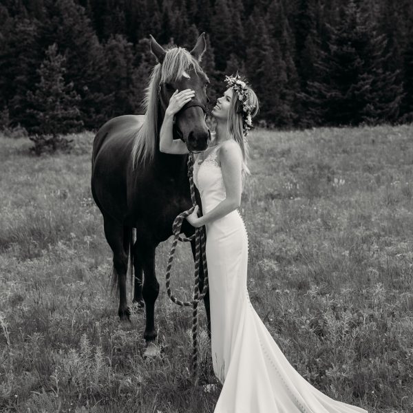 Wedding photos with bride and horse by Calgary Rocky Mountain Wedding Photographer